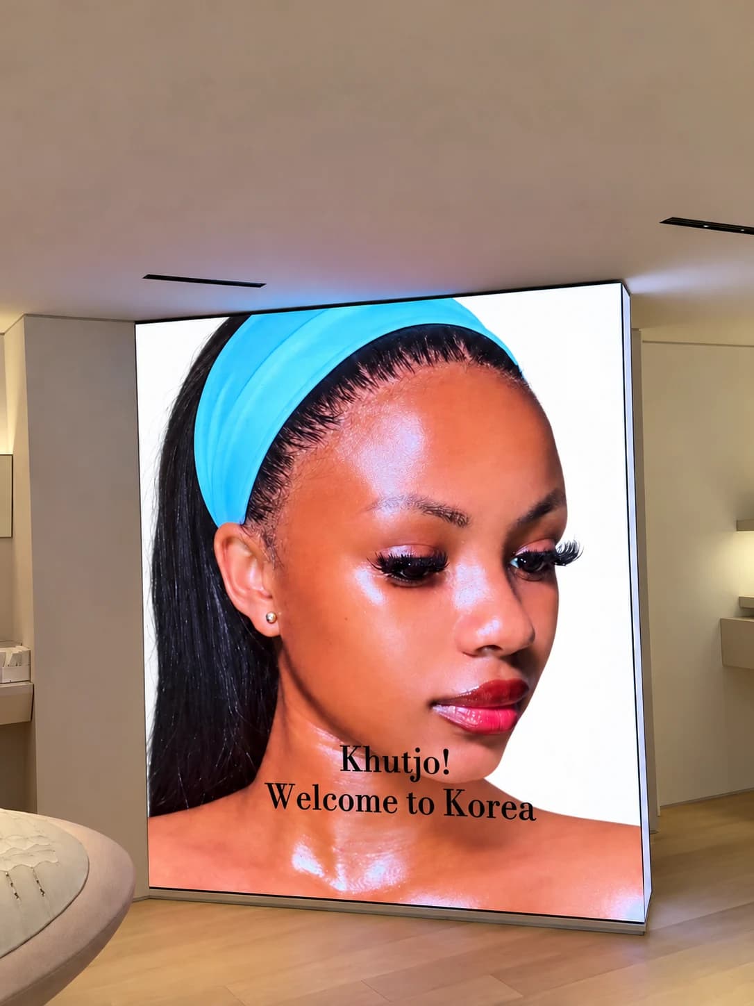 Khutjo Matsoma on a large welcome screen reading “Khutjo! Welcome to Korea”